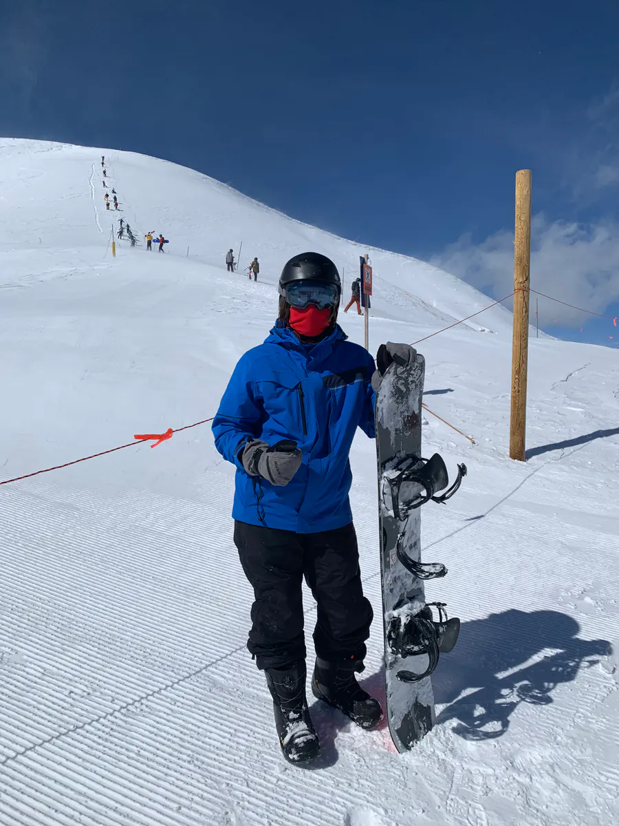 Michael snowboarding on a snowy mountain